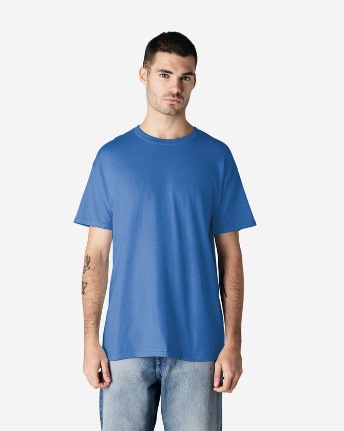 A blue Gildan Heavy Cotton Adult T-Shirt on a male model, featuring short sleeves and a relaxed fit.