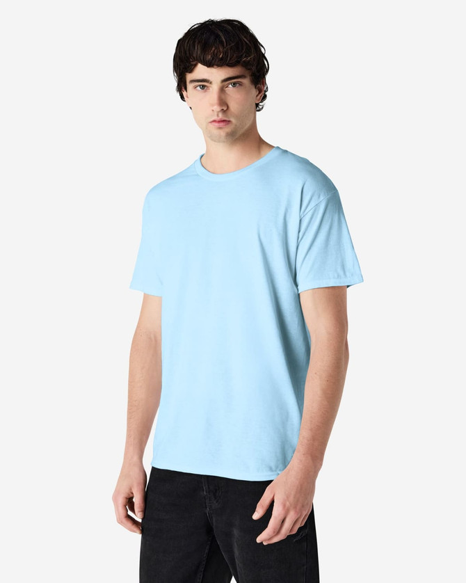 A light blue Gildan Heavy Cotton adult t-shirt is displayed on a model. It features short sleeves and a simple design.