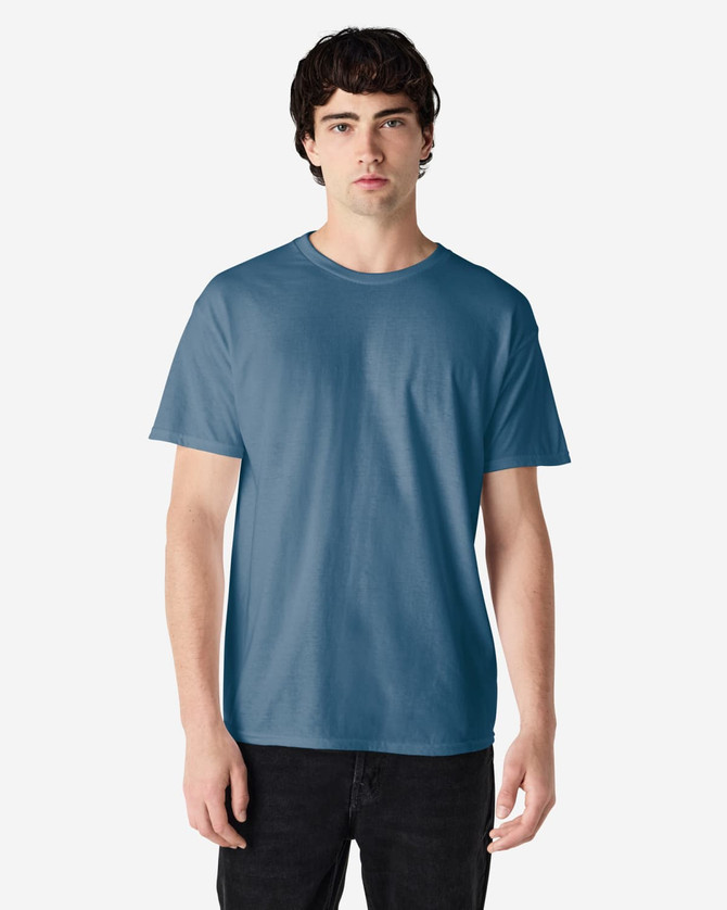 A blue Gildan Heavy Cotton Adult T-Shirt on a model, featuring a plain design and a logo on the label.