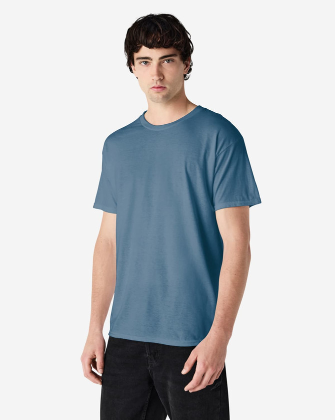 A blue Gildan Heavy Cotton adult t-shirt displayed on a model, featuring a simple design and a logo.