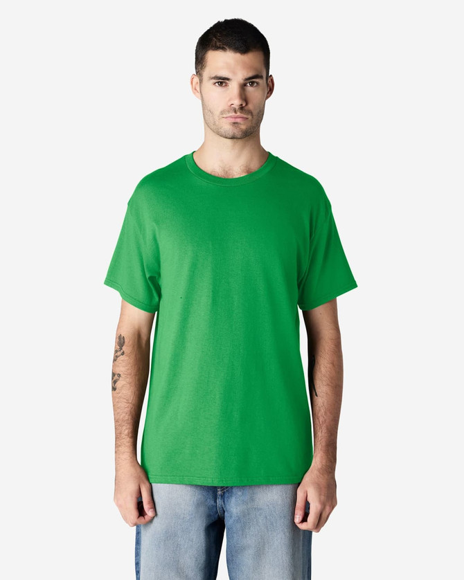 A green Gildan Heavy Cotton Adult T-Shirt displayed on a model against a neutral background.