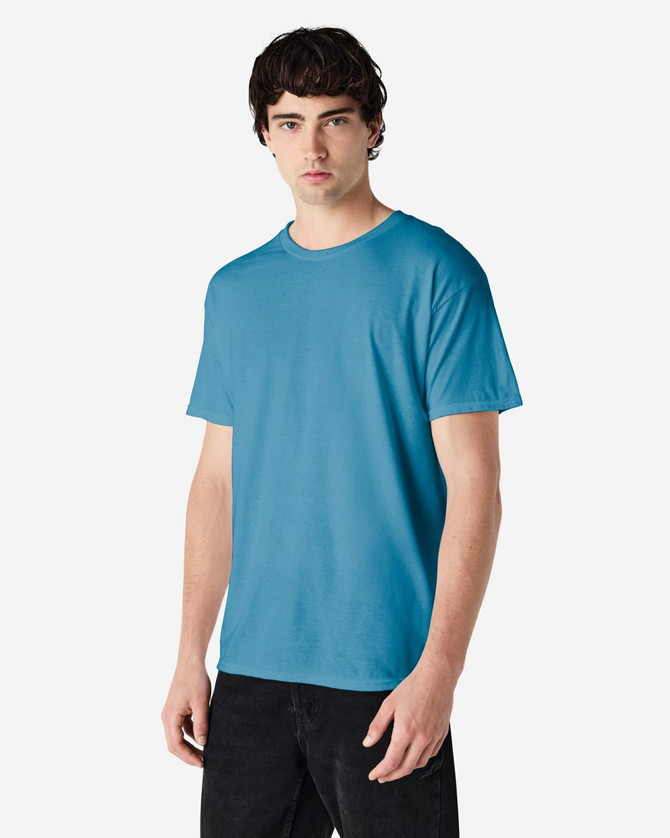 A blue Gildan Heavy Cotton adult t-shirt displayed on a model, featuring a simple design and a logo.