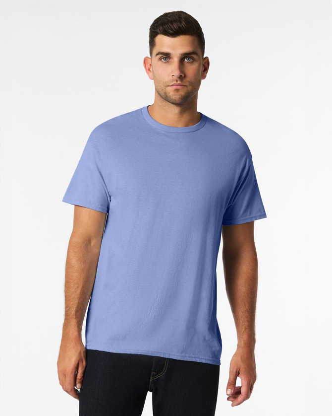 A blue Gildan Heavy Cotton Adult T-Shirt displayed on a model, featuring a round neckline and short sleeves.