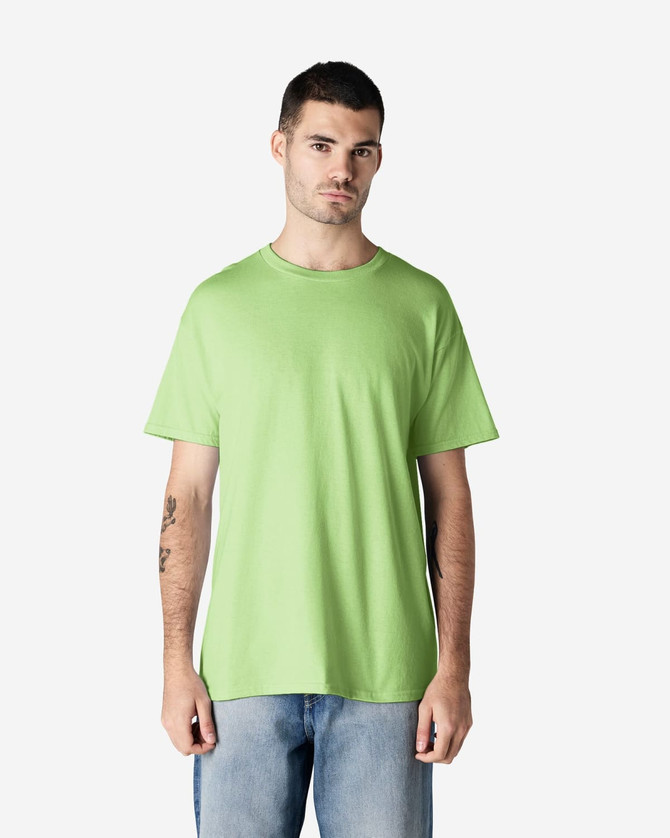 A green Gildan Heavy Cotton Adult T-Shirt displayed on a model, featuring a simple design and crew neck.