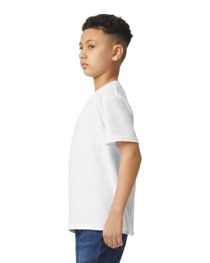 A youth T-shirt in white, displayed on a model from the side, showing its relaxed fit and style.