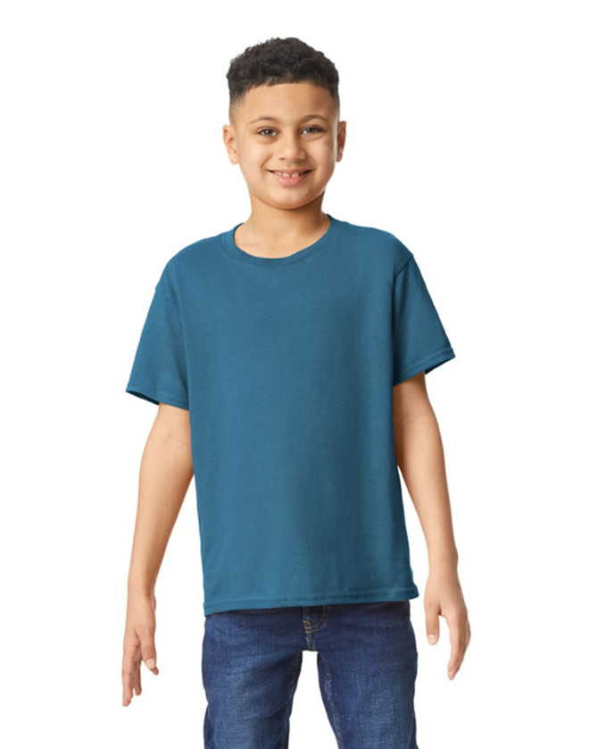 A youth t-shirt in teal, displayed on a smiling child. The shirt has short sleeves and a round neckline.