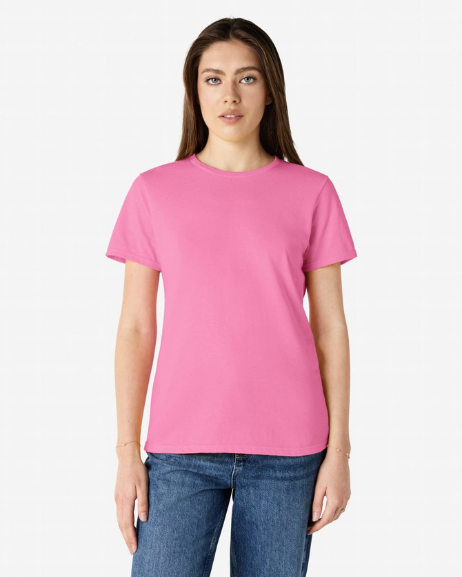 A pink Gildan Heavy Cotton Ladies' T-Shirt displayed on a model, featuring a round neck and short sleeves.