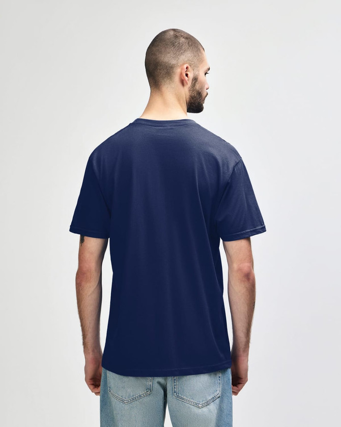 A navy blue Gildan Softstyle adult midweight T-shirt displayed from the back, featuring a simple design and a logo.