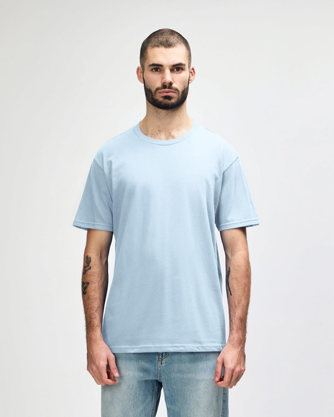 A light blue midweight T-shirt on a male model, featuring a crew neck and short sleeves. It includes a logo on the side.