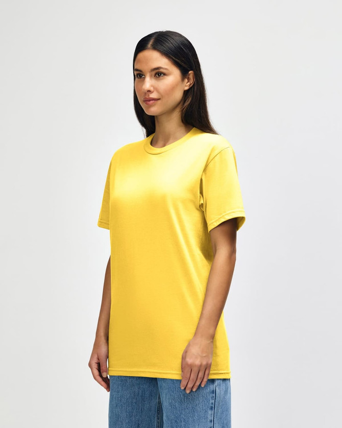 A yellow and blue Gildan Softstyle Adult Midweight T-Shirt displayed on a model. The shirt has a logo.