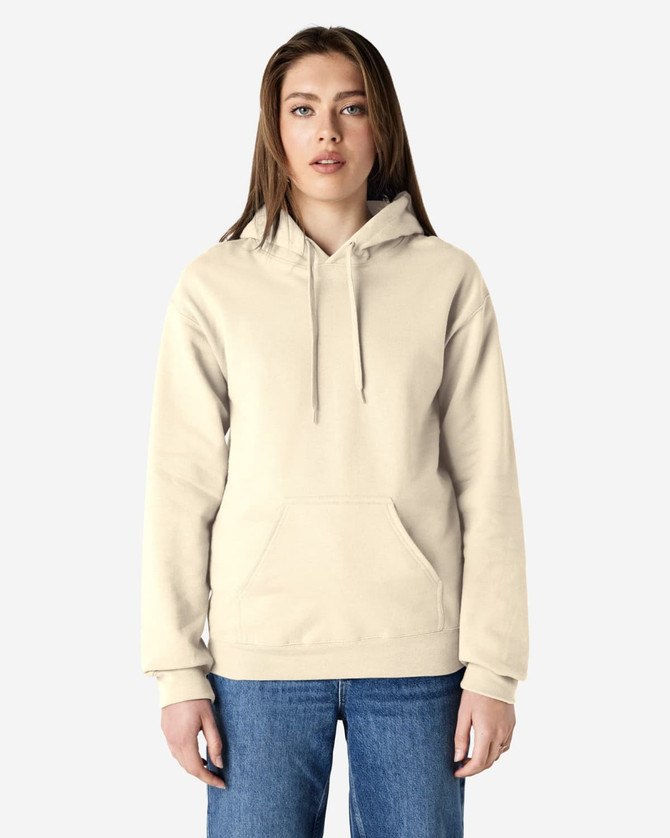 A beige hooded sweatshirt with a front pocket and adjustable drawstrings, worn by a model standing against a plain background.