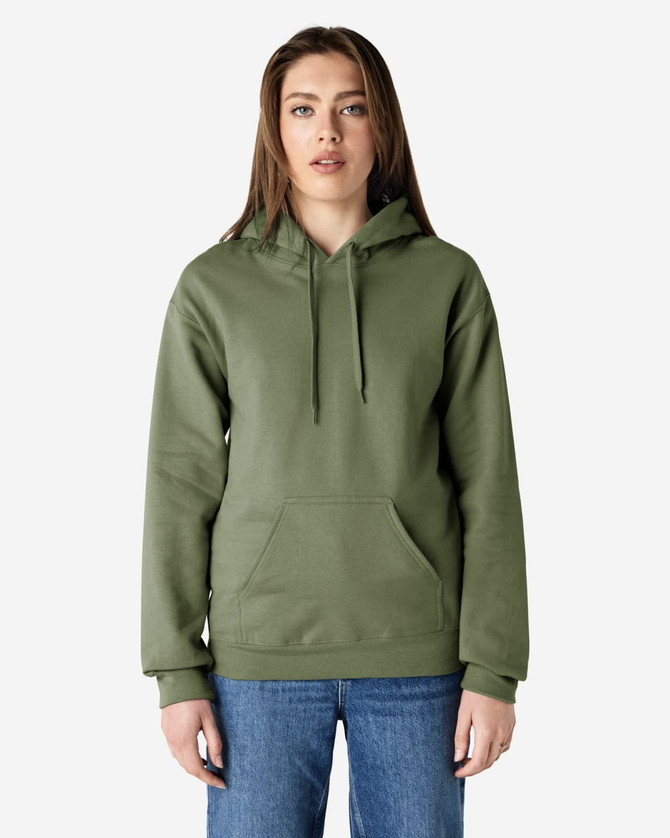 A woman wearing a green hooded sweatshirt with a front pocket and drawstring, standing against a plain background.