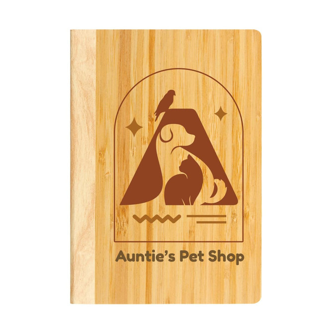A bamboo notebook featuring a pet-themed design and a logo, showcasing a warm, natural wood color.