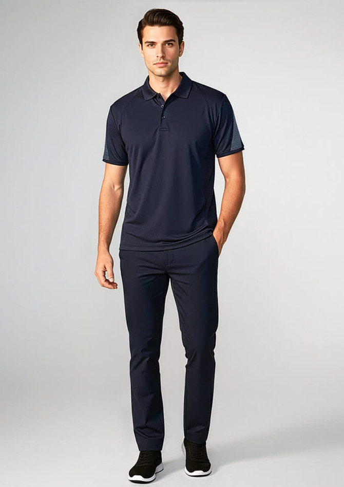 A navy short sleeve polo shirt worn by a model, paired with matching navy trousers and black shoes.