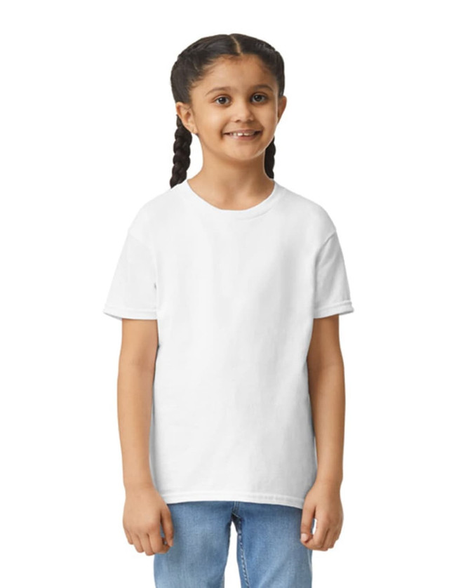 A white Gildan Youth Ultra Cotton short sleeve T-shirt on a smiling child, featuring a logo on the sleeve.
