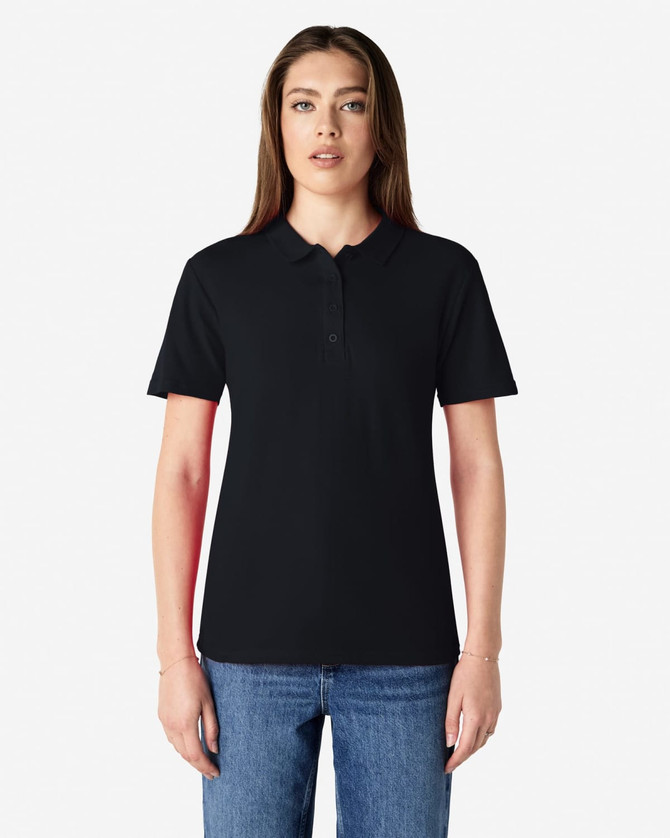 A black Gildan Softstyle ladies' double pique polo shirt with a logo, displayed on a model against a plain background.