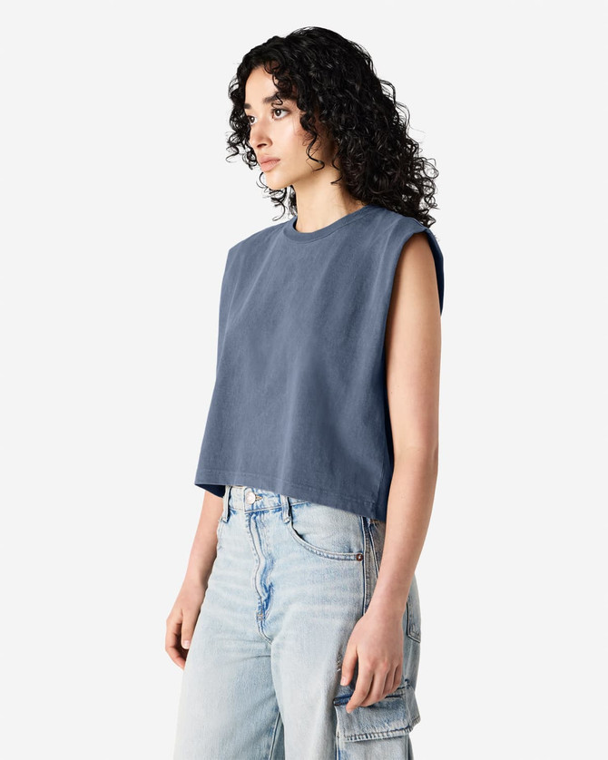 A sleeveless, cropped muscle t-shirt in deep blue, featuring a simple design and a logo.