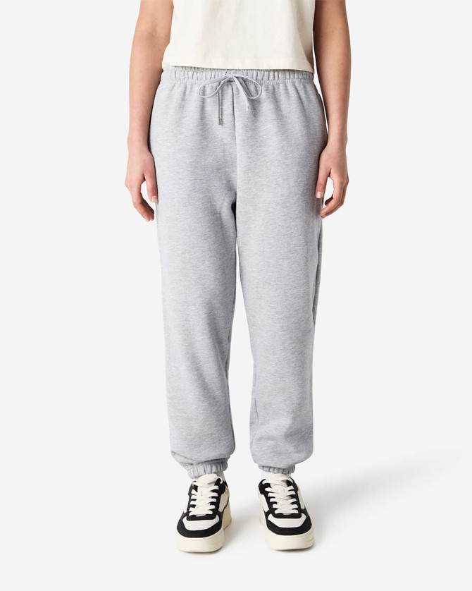 Grey unisex sweatpants with an elastic waistband and cuffs, featuring side pockets and a logo.