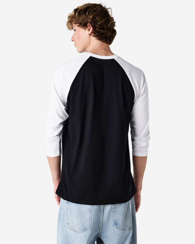 A black and white unisex raglan T-shirt featuring three-quarter sleeves and a logo on the back.