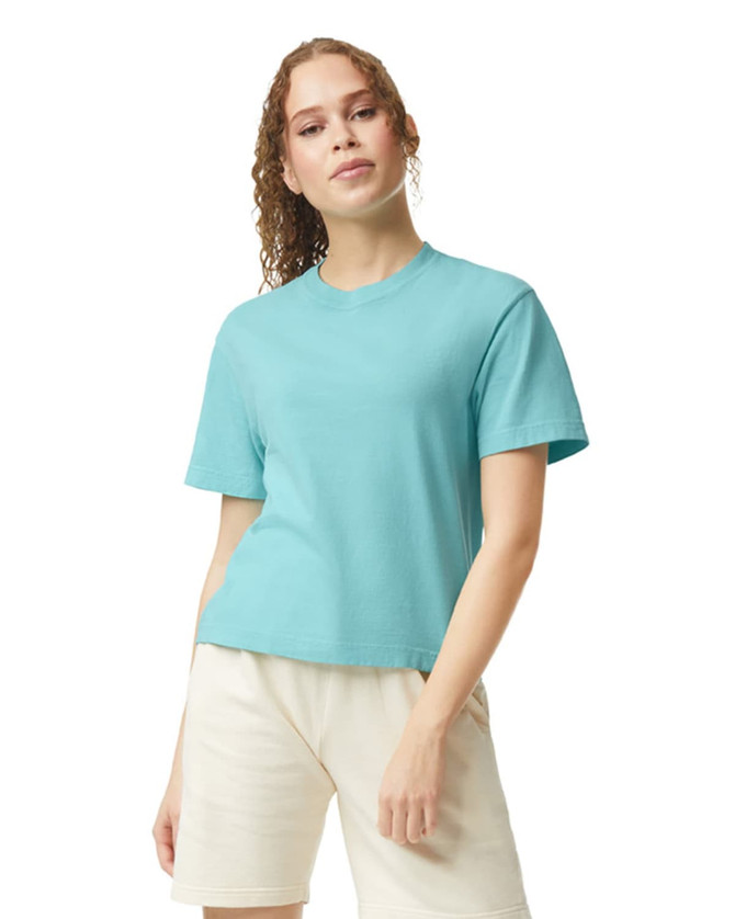 A lightweight, turquoise boxy T-shirt for women, featuring a round neckline and short sleeves. It has a logo.