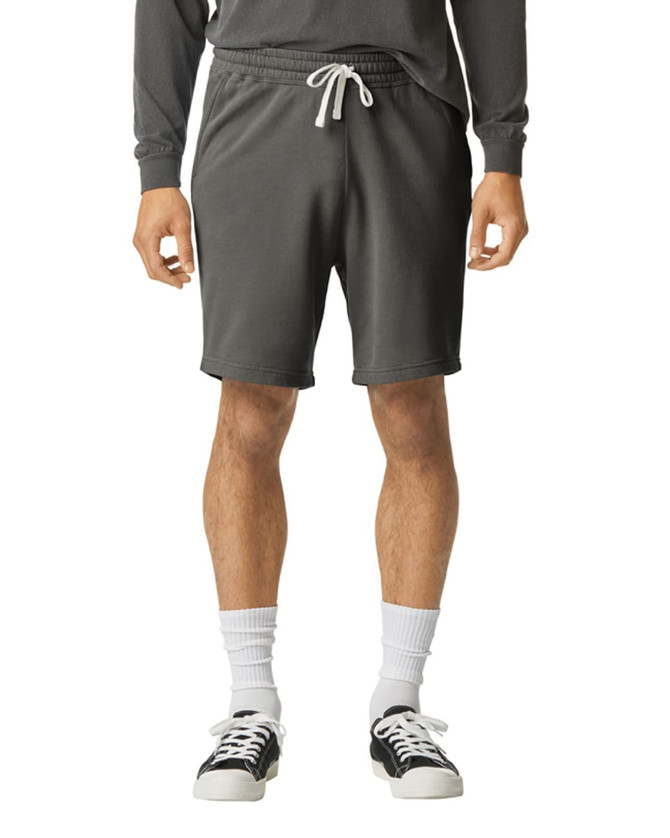 Lightweight sweatshorts in dark grey with an elastic waistband and drawstring, paired with casual footwear.