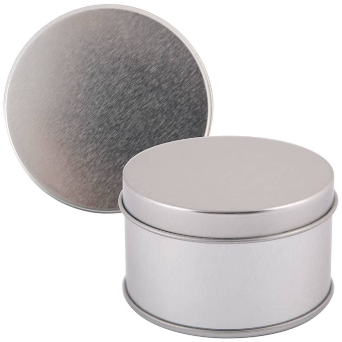 A silver round tin with a smooth finish and a removable lid, positioned upright next to its lid.