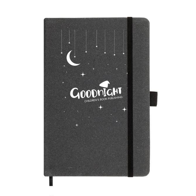 A black recycled leather notebook with a moon and star design, featuring an elastic closure and a logo.