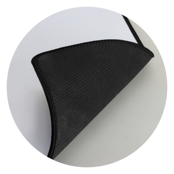 A black Deluxe Mouse Mat with a textured surface and stitched edge, showing a folded corner.