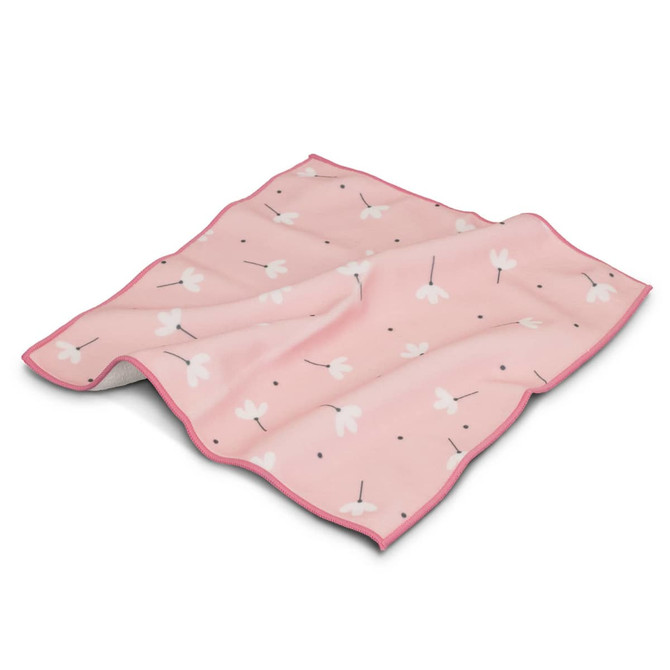 A medium-sized pink blanket featuring a floral pattern with white flowers and black dots, edged in a contrasting colour.