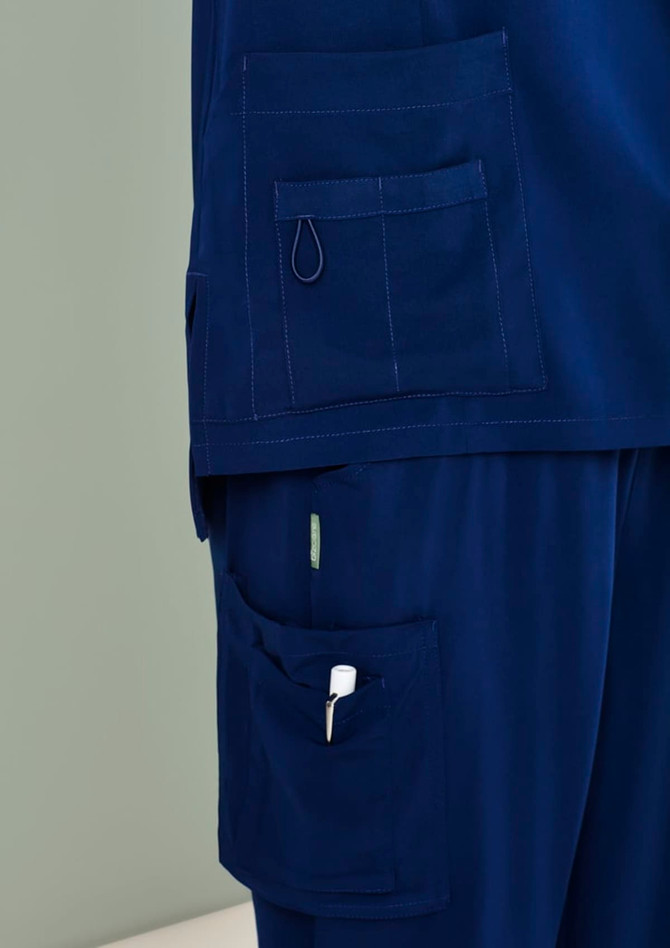 Navy blue women's scrub pants featuring multiple pockets and a loop for attachments.