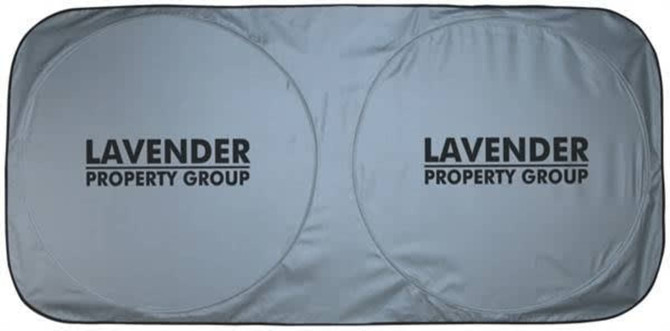 A grey sunshade with two circular cutouts and a prominent logo.