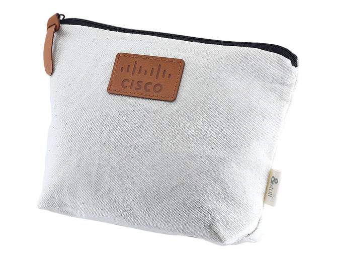 A cream-coloured toiletry pouch with a leather label and zipper, featuring a logo on the front.