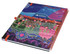 A vibrant A4 side-bound notebook with a colourful, artistic cover design and a logo. It features a red spiral binding.