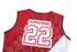 A red and white basketball uniform jersey featuring intricate designs and a number 22 on the back, with a logo.