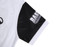 A white and black sports jersey featuring a predominantly white body and black sleeves. The sleeve has a logo.