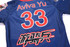 A blue baseball club shirt featuring the number 33 and name "Aviva Yu," with a logo on the front.