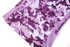 A purple camo-patterned sports jersey with mesh detailing and a logo.