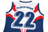 A sports jersey in blue, white, and red featuring a large number 22 and a logo.