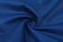 A textured fabric in a rich royal blue colour, showcasing its smooth and lightweight quality.