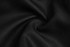 A close-up of black fabric, showcasing a smooth, textured surface with a slight sheen.