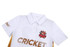 A white cricket uniform featuring a collar, decorative stripes, and a logo. The word "CRICKET" is prominently displayed.