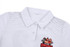 A cricket uniform in white with a polo collar and a logo on the chest, featuring a textured stripe pattern.