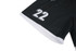 A black sports jersey featuring white details and the number 22, with a logo on the fabric.