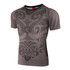 A short-sleeved jersey in grey featuring intricate black patterns and designs, along with a logo on the neckline.
