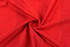 A red fabric featuring a textured pattern, suitable for a women's soccer uniform tee. Contains a logo.