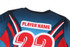 A sports jersey featuring a vibrant blue and red design, with a placeholder for a player name and number 22.