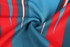 A fabric featuring bold blue, red, and white stripes, designed for rugby team wear. The fabric has a smooth texture.