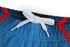 A pair of rugby shorts featuring a blue body with red accents and a grey drawstring at the waistband.