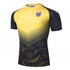A short-sleeved yellow and navy rugby shirt with a logo and a patterned design on the lower half.