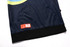 A navy blue hoodie featuring a pocket and a black hem. It includes a logo on a tag.